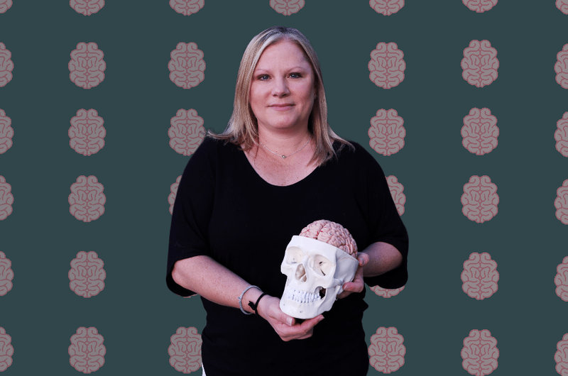 Jessica Trego holding a skeleton head for brain injury