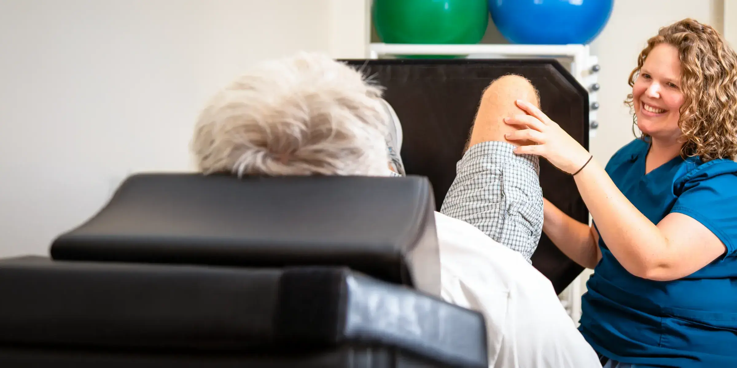 therapist works with patient